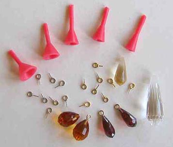 5 different angle wax caps and air-abraded briolettes;
ultrasonically drilled briolettes and gold pin-caps.